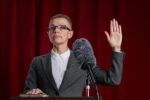 woman taking the stand in court