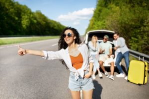 Hitchhikers on the side of the highway