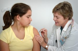 young girl getting vaccinated