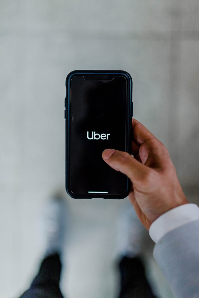 pulling up Uber rideshare on the cell phone