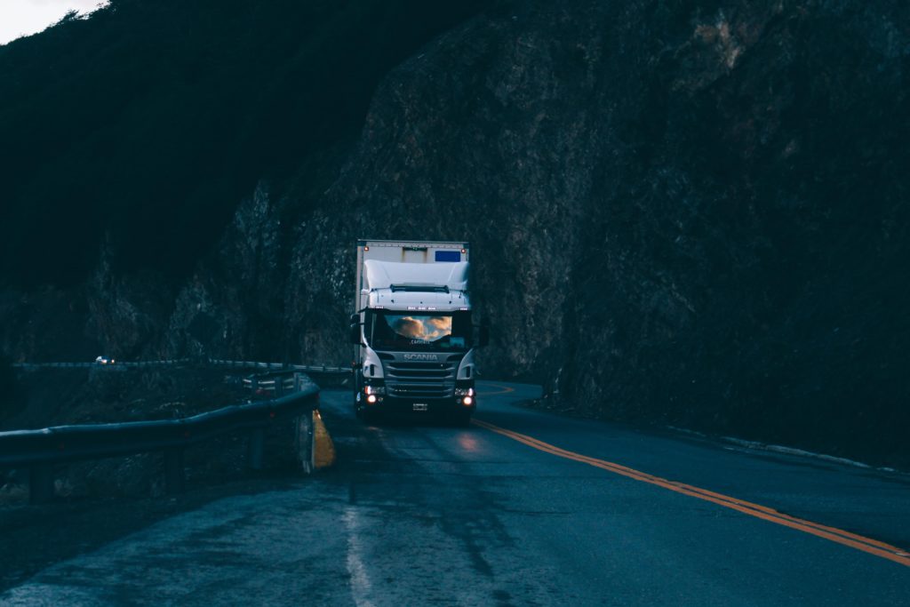 18-wheeler truck on wet highway