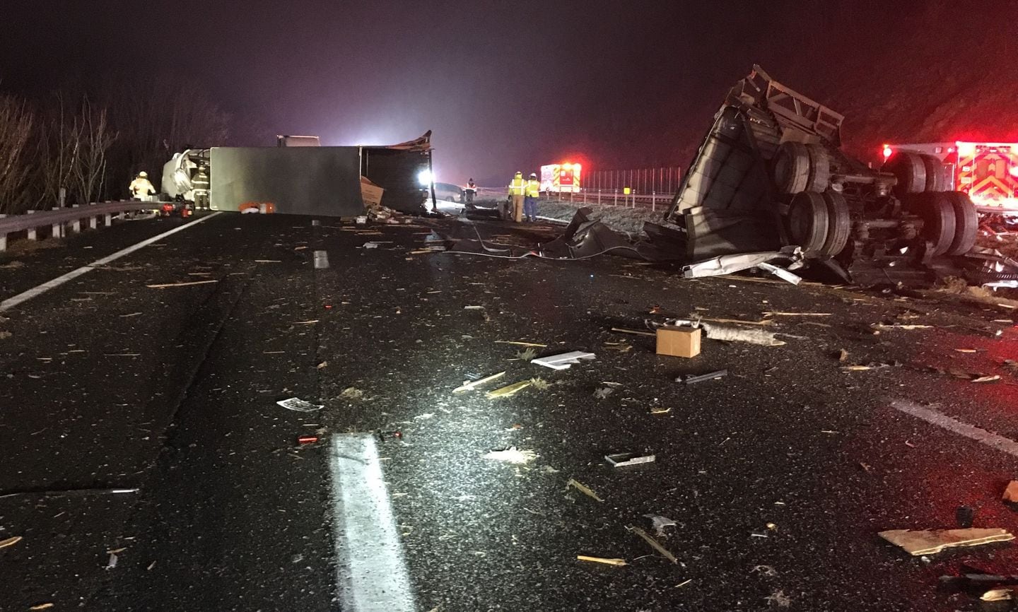 Tractor trailer accident covering highway