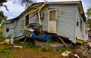 hurricane crashes trailer home atop car