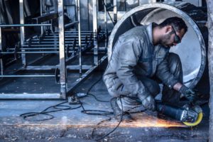 A man welding with sparks flying