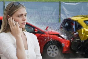 girl making call after car crash