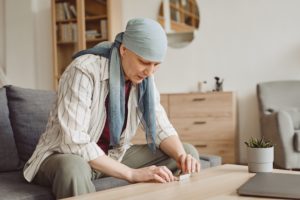 cancer patient rolling a marijuana joint