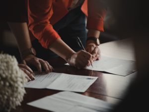 man signing a release