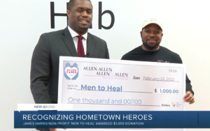 Irvine Reaves makes a donation for Men to Heal