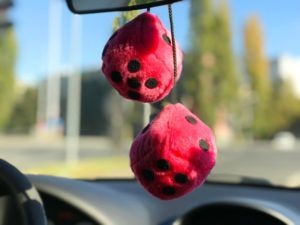 fuzzy dice hanging from a rear view mirror