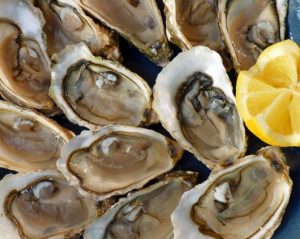 raw oysters and lemon on a plate