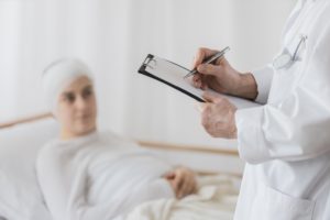 woman with a head injury in bed