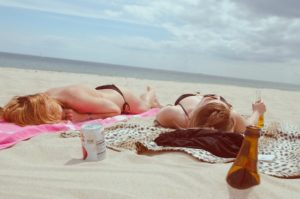girls tanning on the beach