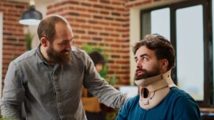 man with a neck brace that was hurt at work