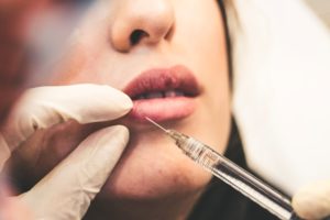 woman receiving a lip injection