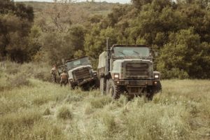 riding trucks through a military base