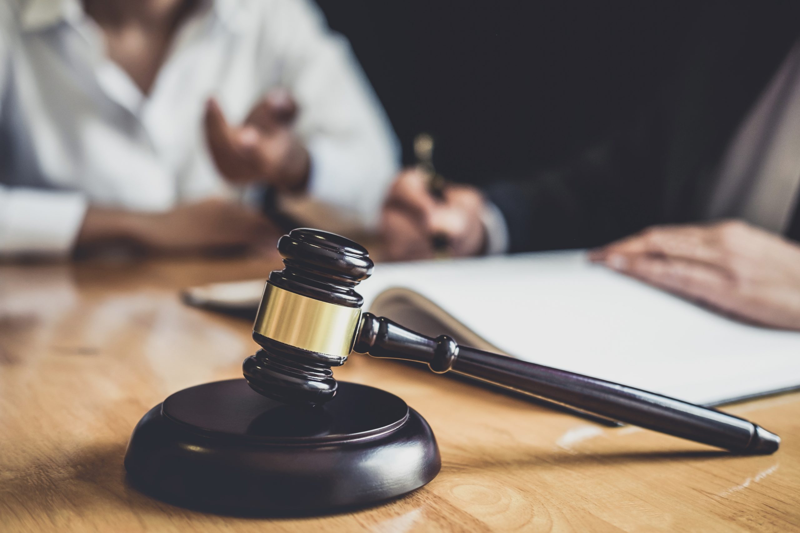 Male lawyer or Counselor working in courtroom have meeting with client are consultation with contract papers of real estate, Law and Legal services concept.