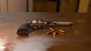 gun and bullets on a table