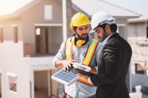 A construction foreman and an architect discussing solar project