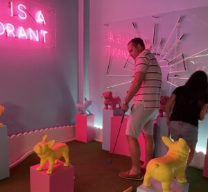 Gueest at The Park RVA under a neon pink light