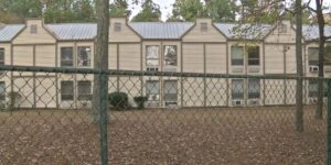 Nursing home behind a chain link fence