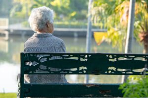 elderly woman on a park bench