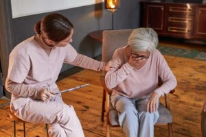 elderly woman crying in a nursing home