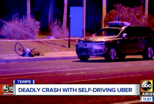 News footage from TV of a car crashing with a bike