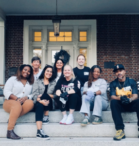Group of Allen & Allen volunteers on a stoop