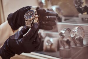 jewelry thief looking at a watch