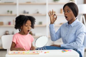 speech therapist working for a child