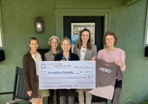 Allen & Allen attorney Kari La Fratta presents check to Georgia's Friends