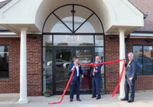 Ribbon cutting in front of Stafford office of Allen & Allen