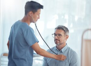 Man getting his heart rate recorded with a stethoscope