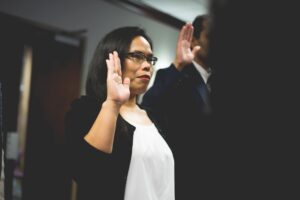 woman swearing in to deposition