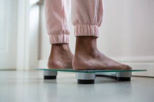 woman standing on scale
