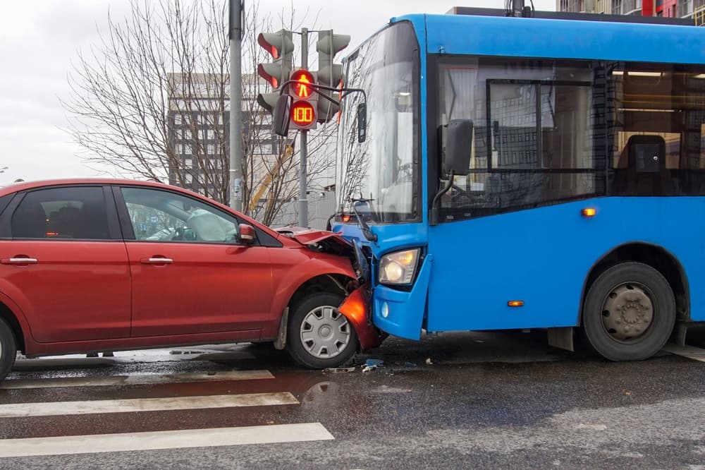 Head-on collision between bus and car. Head-on collision between bus and car.