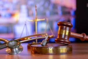 Stethoscope with judge gavel.